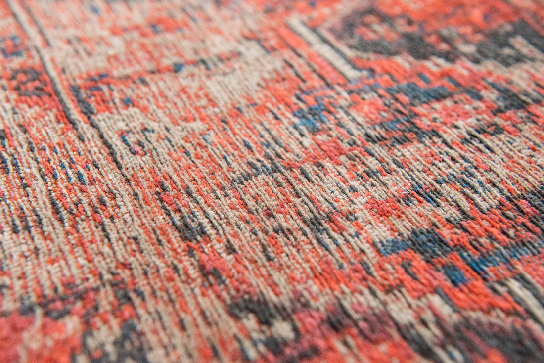 Red flatweave rug with faded persian design of floral motifs and gul medallions