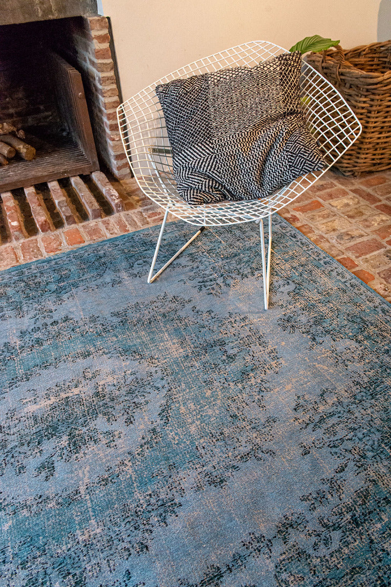 blue vintage style rug with a traditional design