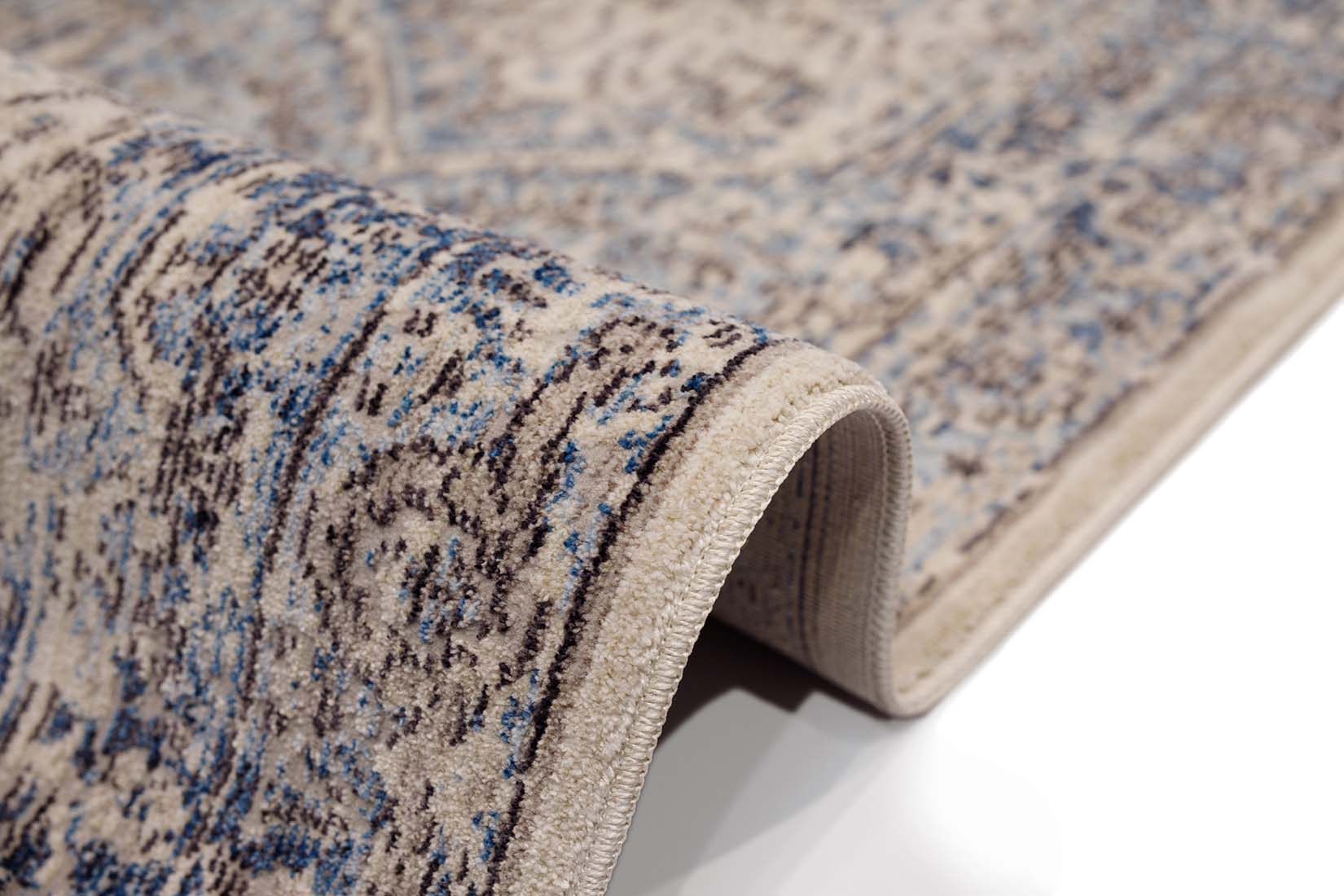 Persian style area rug in blue and grey