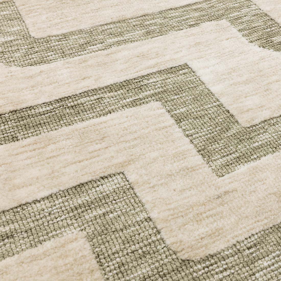 beige and green geometric polyester rug