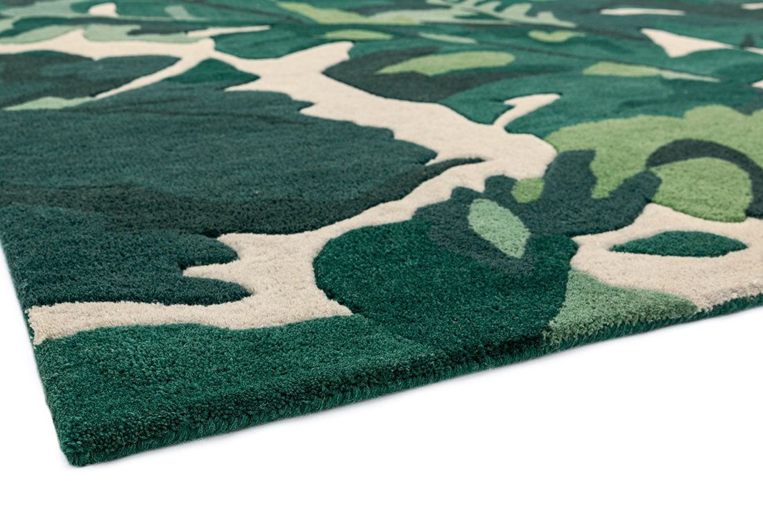 area rug with a green palm leaf design