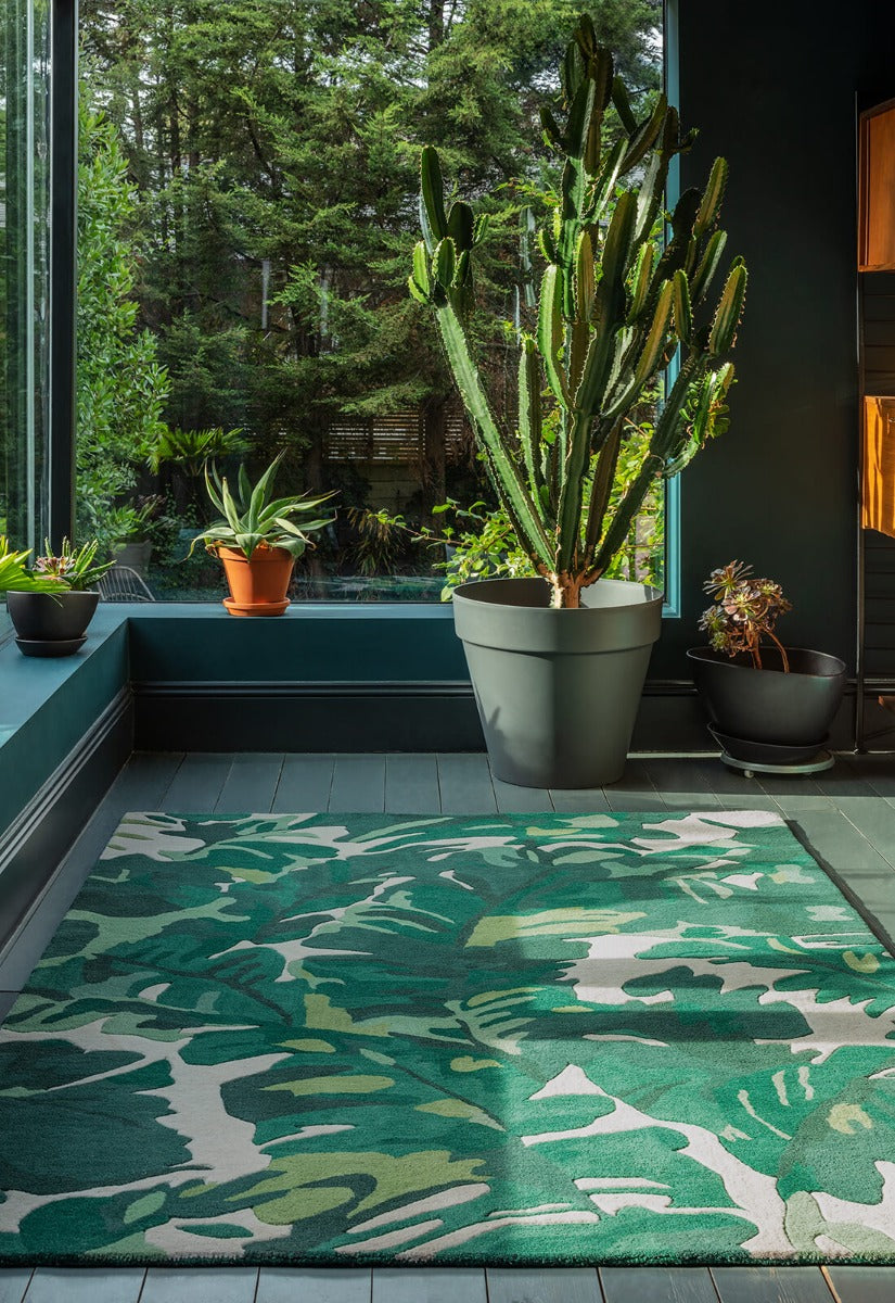 area rug with a green palm leaf design
