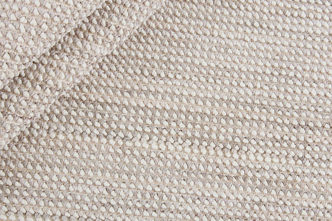 Textured area rug in stone and beige hues