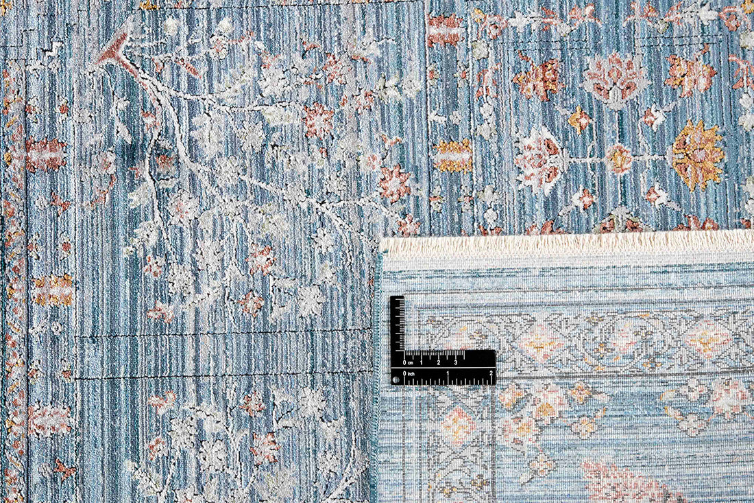 Blue heritage area rug with traditional pattern