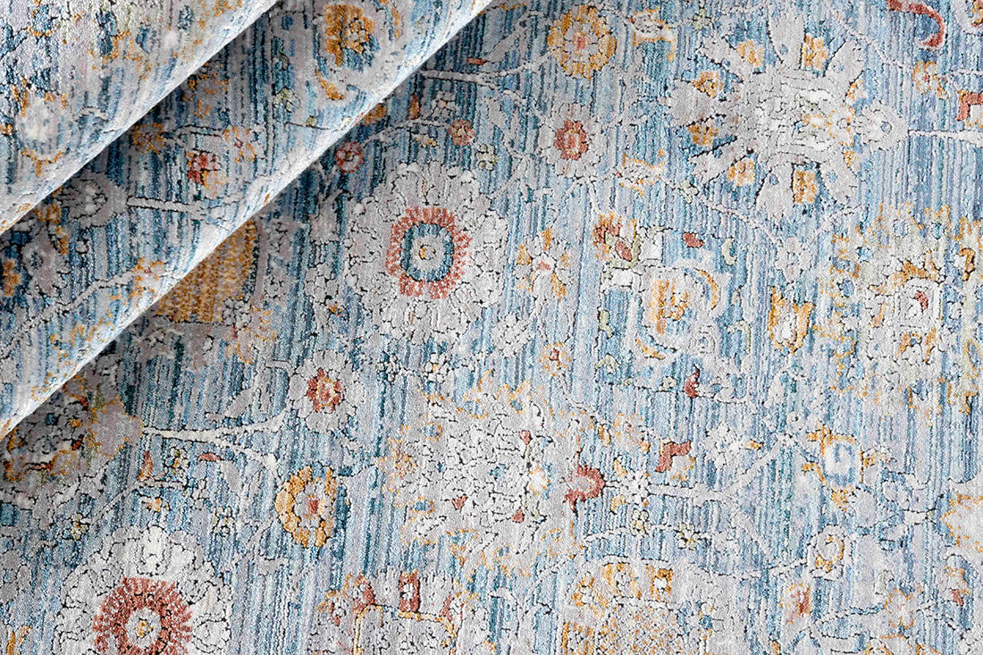 Floral blue heritage area rug with traditional pattern