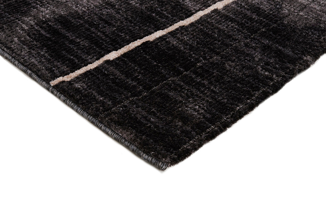 Black rug with minimal cream geometric pattern