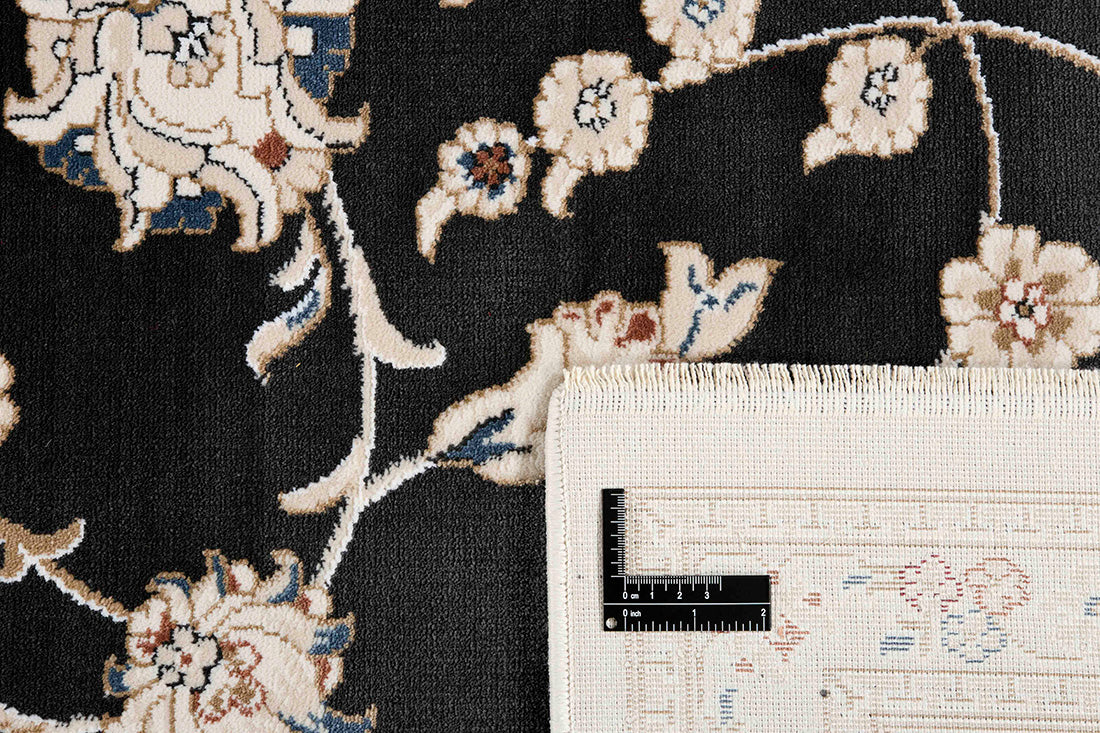Traditional Persian Nain style rug. Detailed black pattern with a white border.