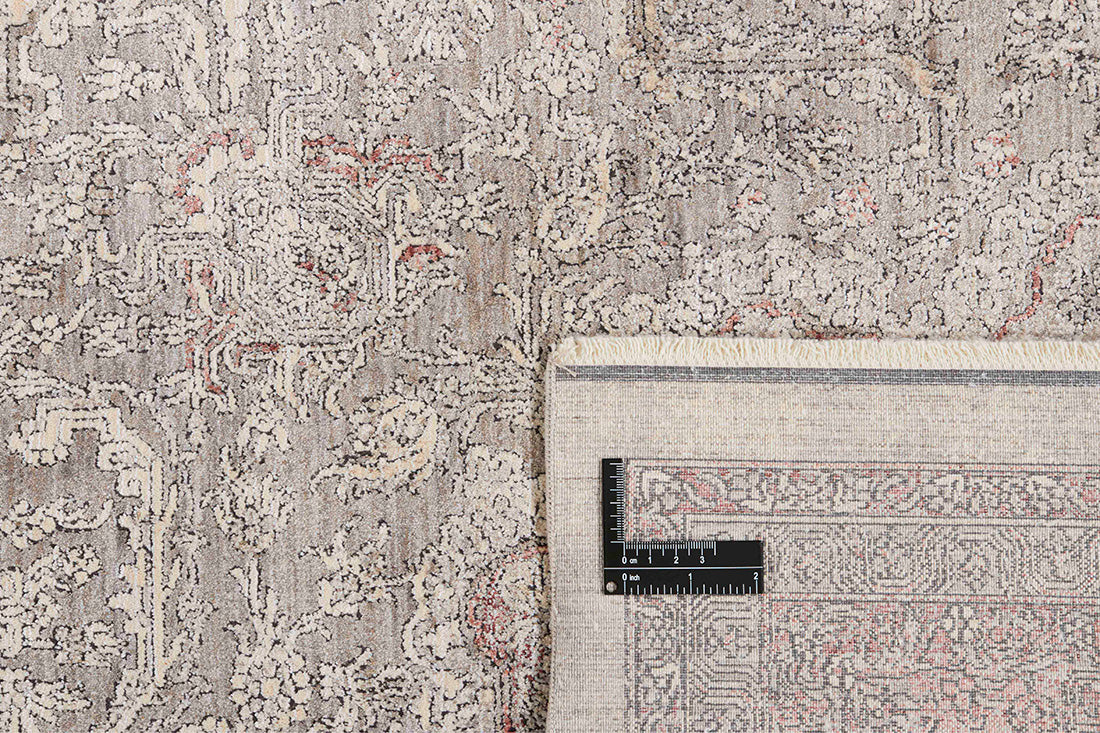 Traditional style rug with beige backing and red patterned border design