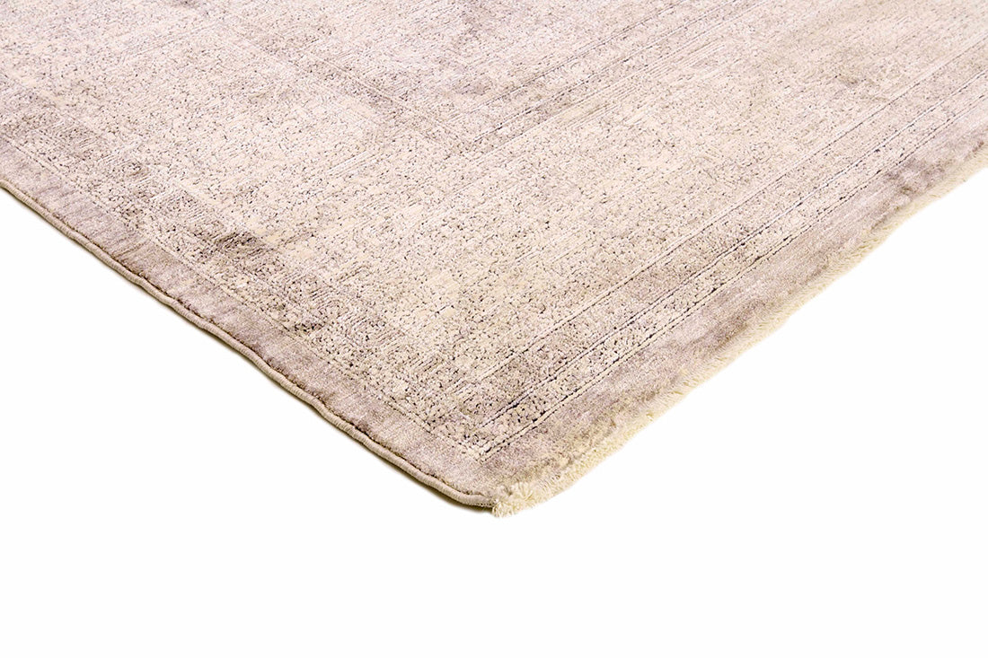 Traditional style rug with beige backing and patterned border design