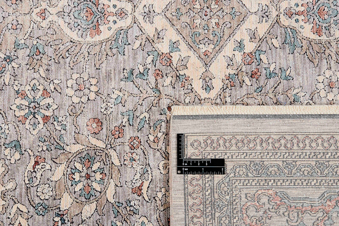 Traditional style rug with beige backing and patterned border design