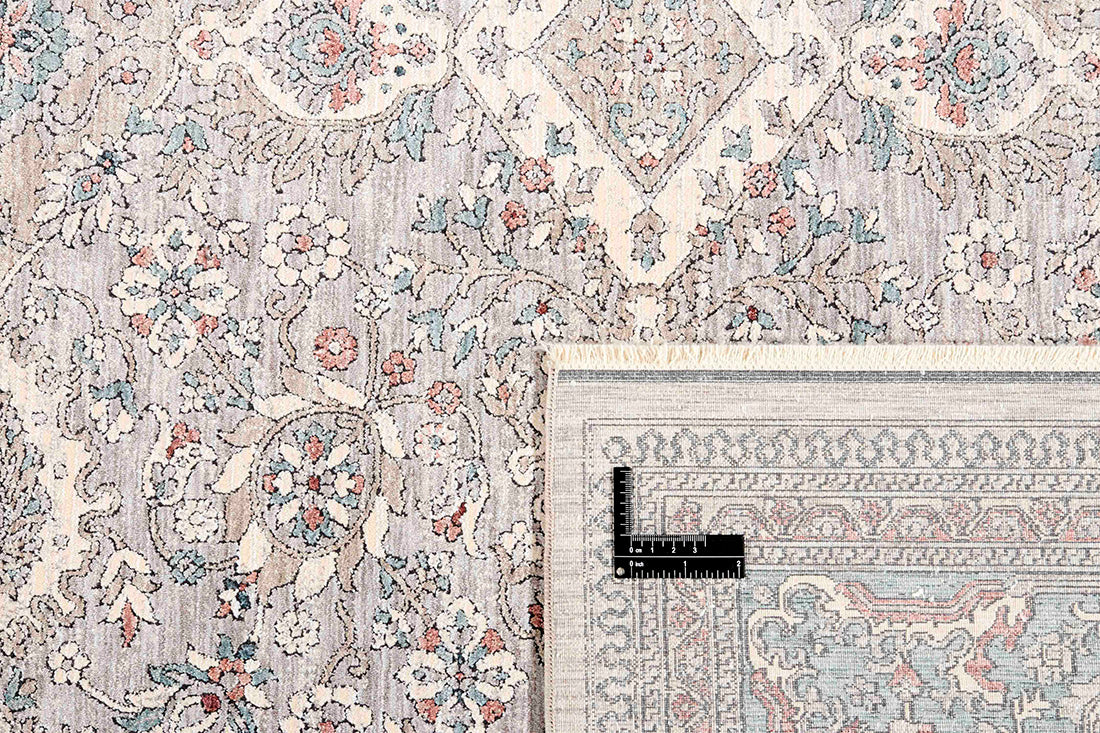 Traditional style rug with beige backing and patterned border design