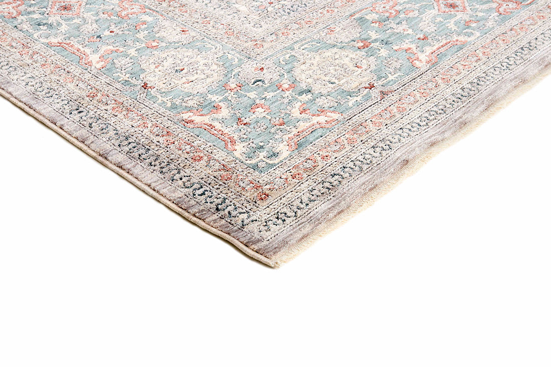 Traditional style rug with beige backing and patterned border design
