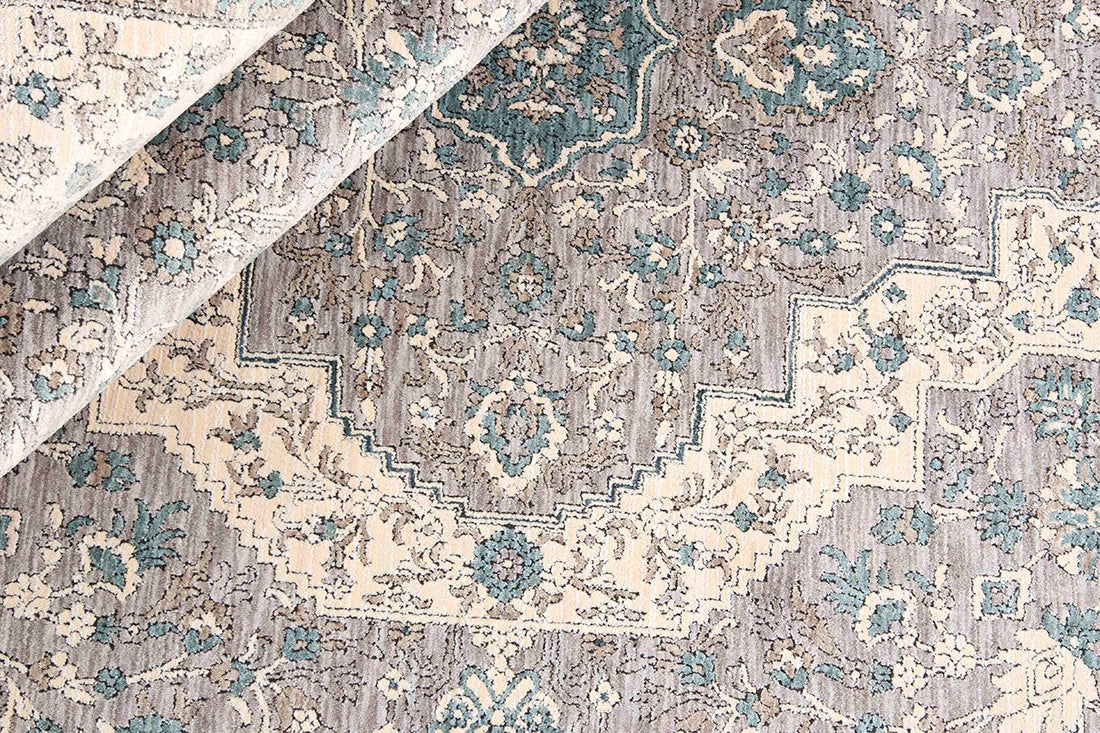 Traditional style rug with beige backing and jade patterned border design