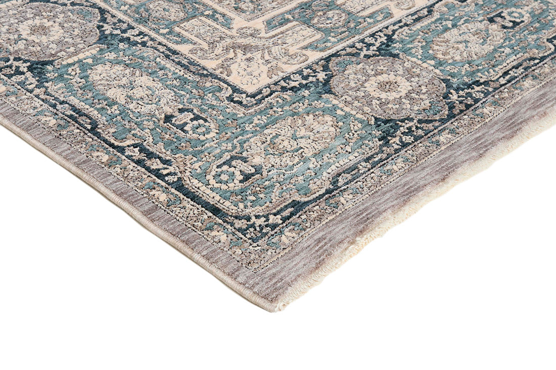 Traditional style rug with beige backing and jade patterned border design