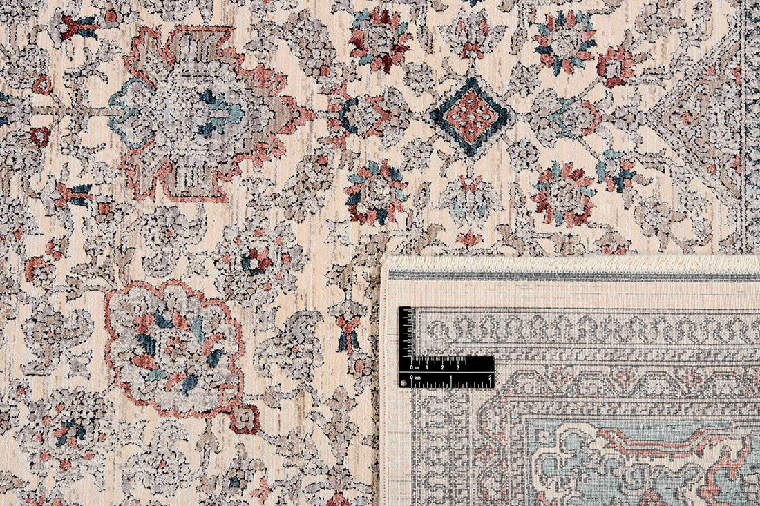 Traditional style rug with cream backing and green patterned border design