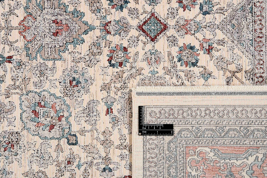 Traditional style rug with cream backing and red patterned border design