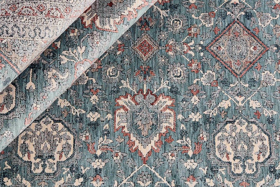 Traditional style rug with green backing and patterned border design