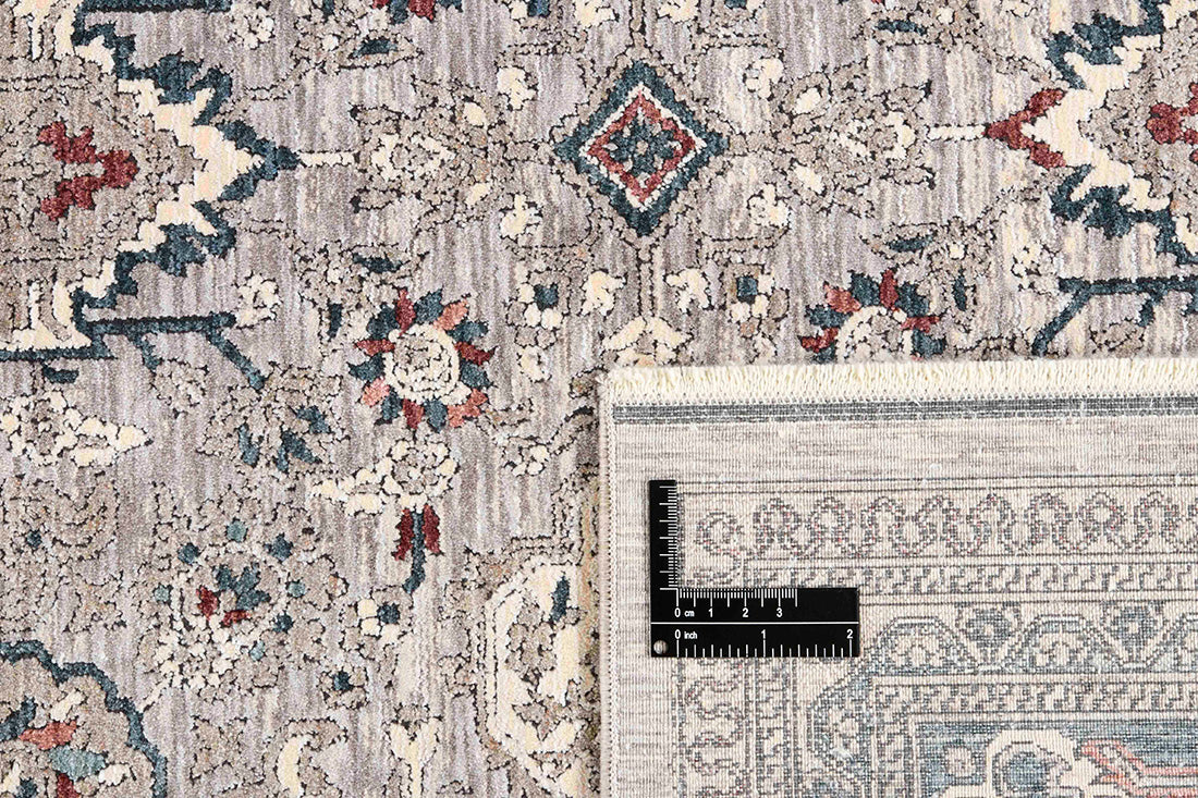 Traditional style rug with grey backing and patterned border design