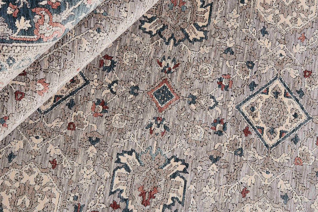 Traditional style rug with grey backing and patterned border design