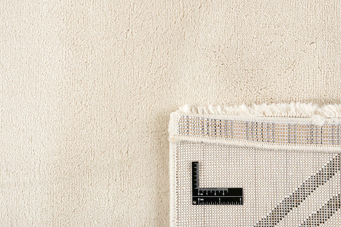 Plain cream Moroccan style rug with minimal abstract geometric pattern