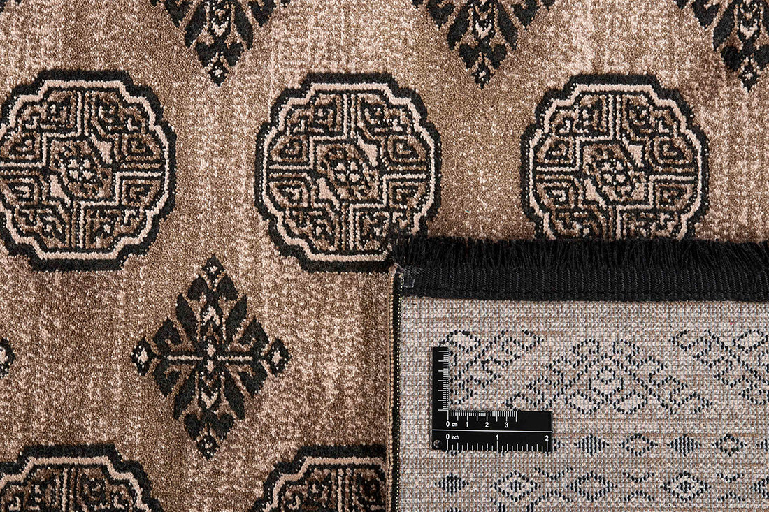 Traditional Bokhara style rug with border. In shades of brown