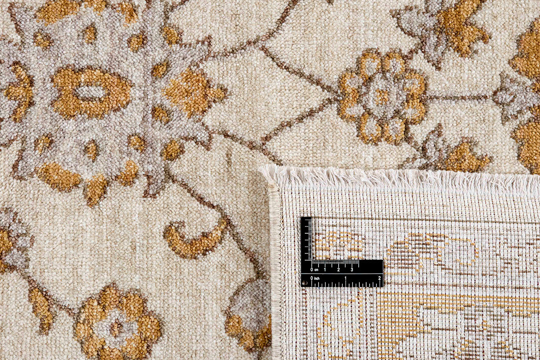 Traditional gold Ziegler-style rug with floral motif