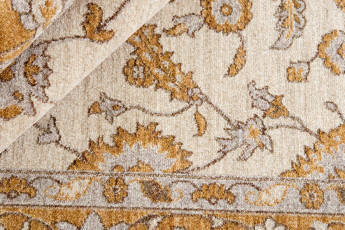 Traditional gold Ziegler-style rug with floral motif