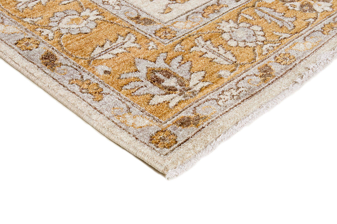 Traditional gold Ziegler-style rug with floral motif