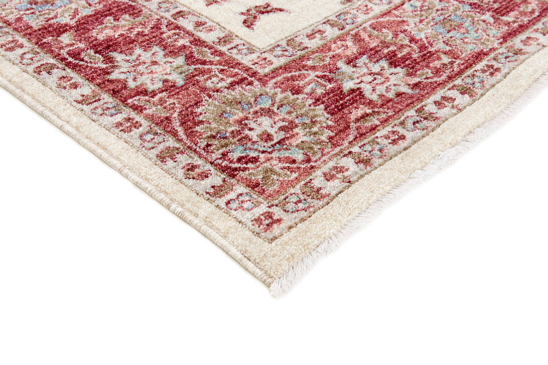 Traditional red bordered Ziegler-style rug with floral motif