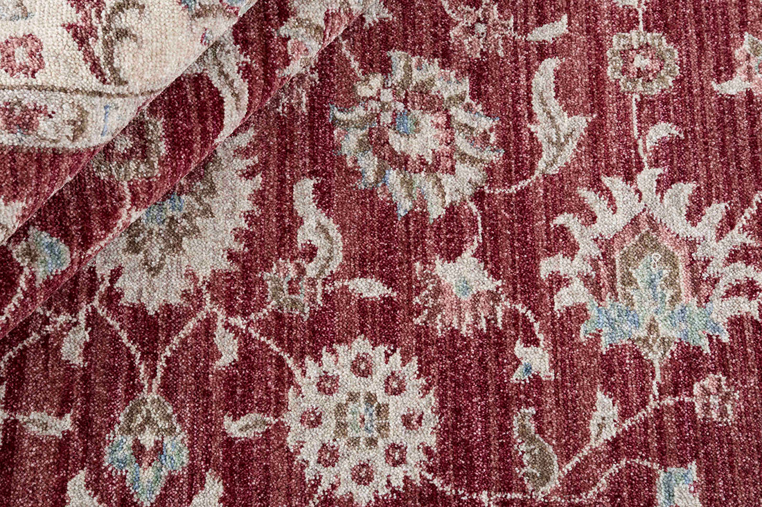 Traditional red Ziegler-style rug with floral motif