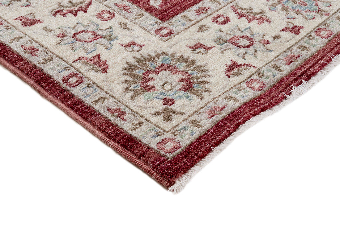 Traditional red Ziegler-style rug with floral motif