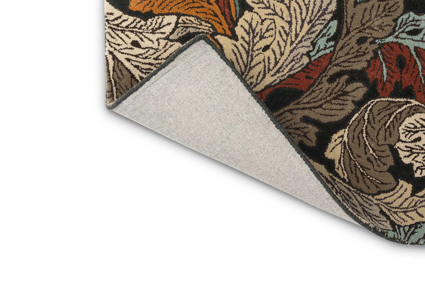 autumnal coloured wool rug with leaf design