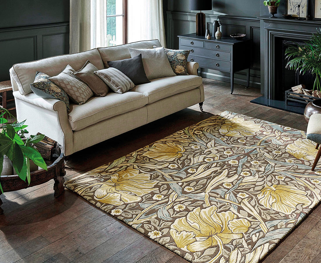 Wool rug with floral and foliage design in brown, grey and gold