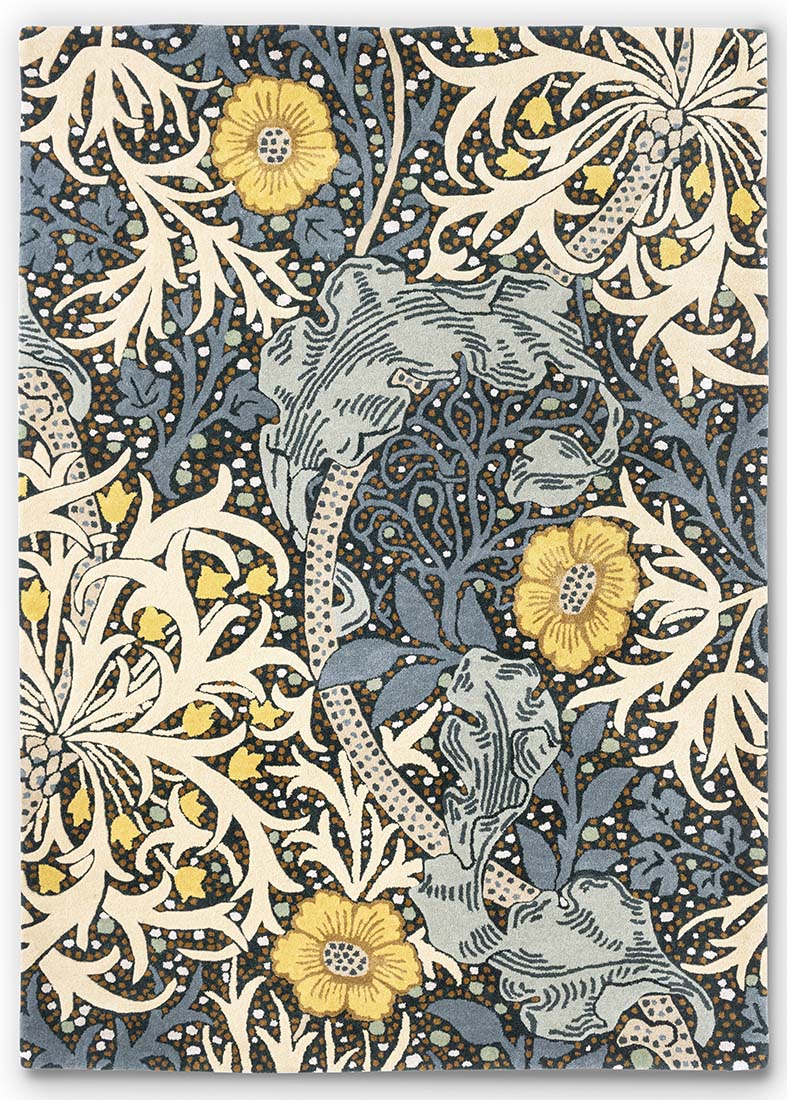 blue, mustard and cream wool rug with nature inspired print