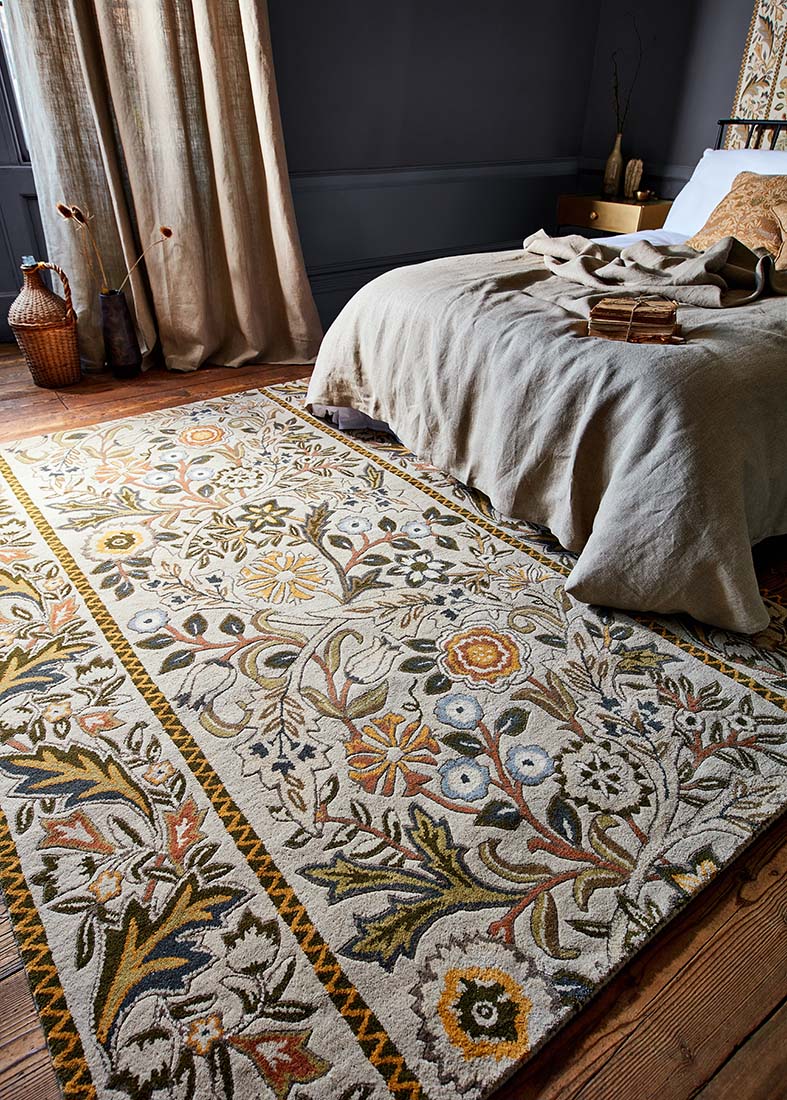 beige wool rug with multicolour floral design