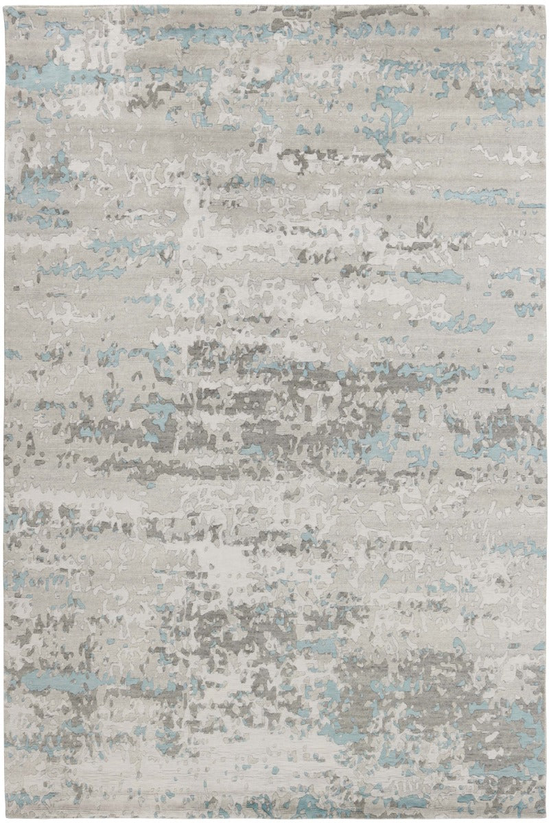 Area rug with abstract design in grey and beige