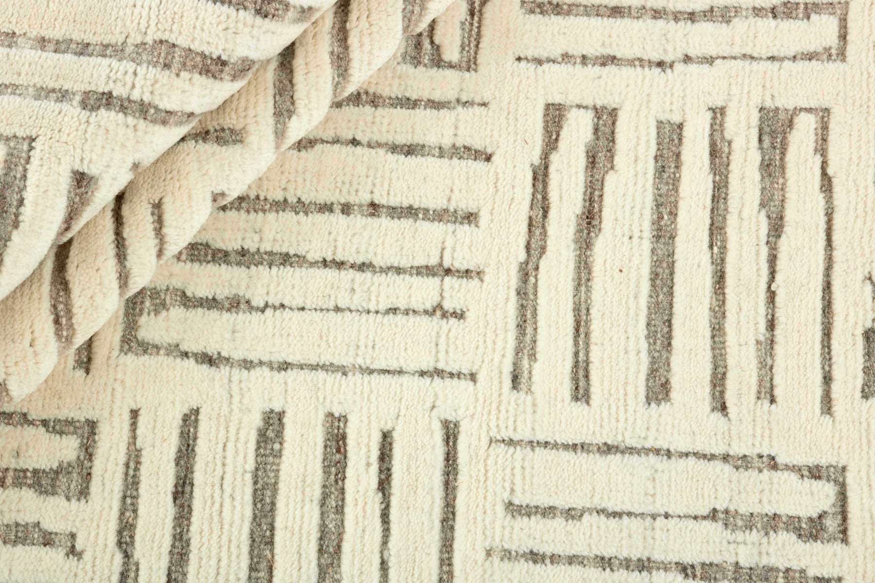 beige area rug with geometric pattern