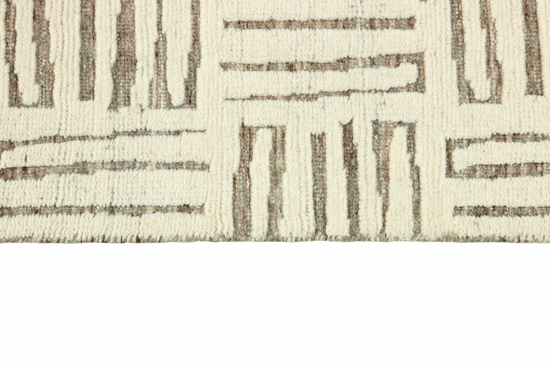 beige area rug with geometric pattern