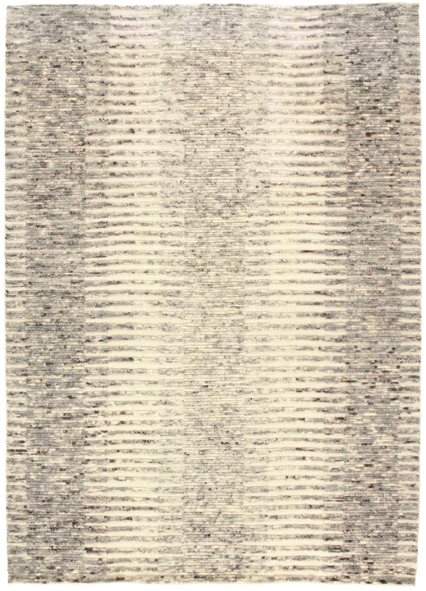 beige area rug with abstract design