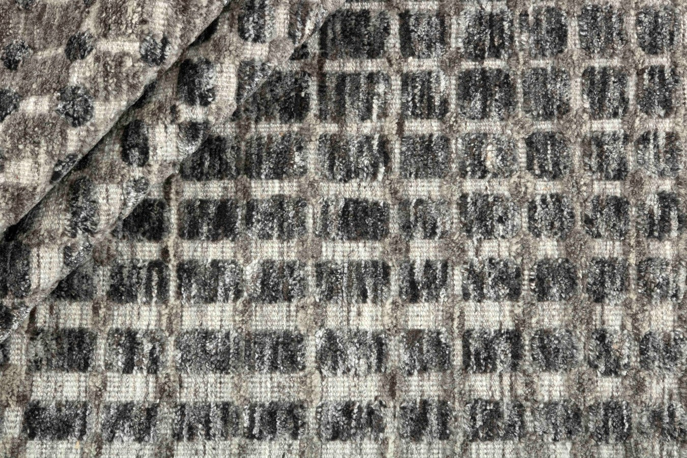 grey area rug with geometric pattern