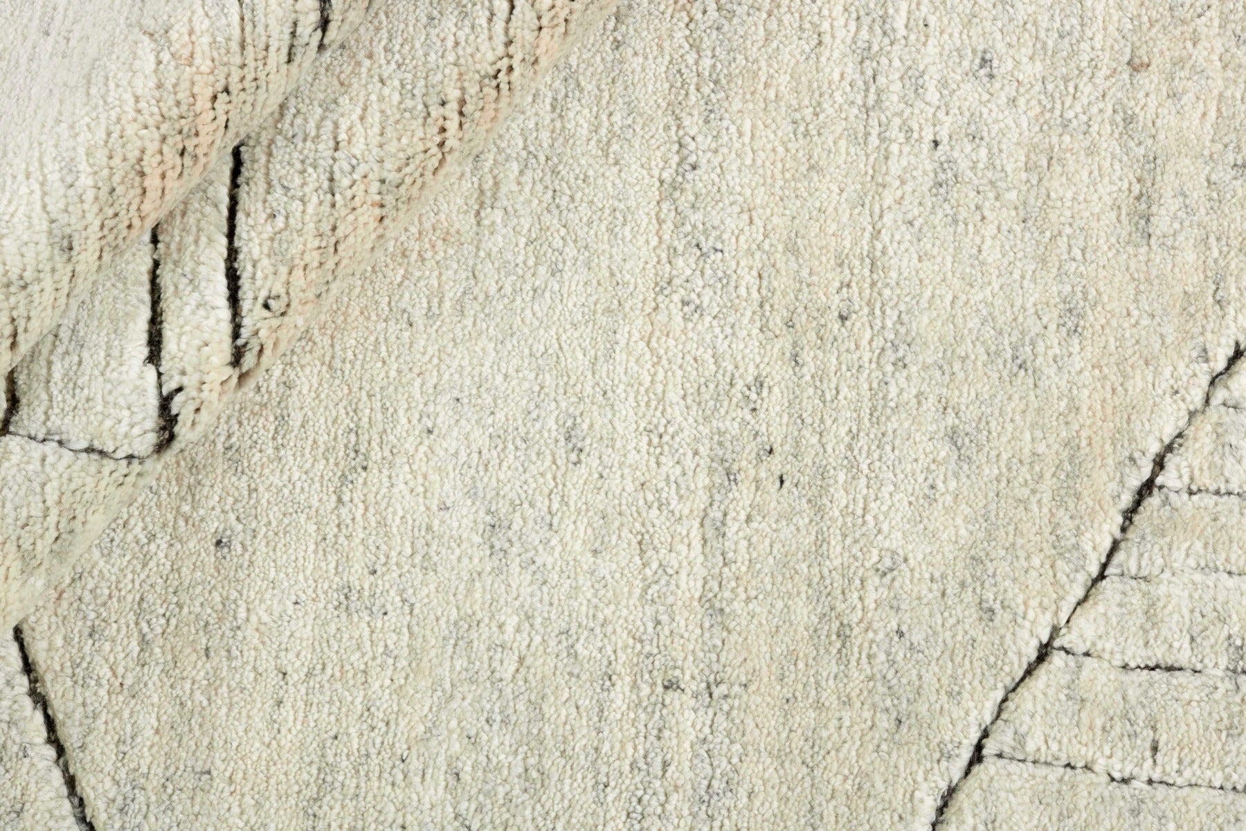 Cream area rug with abstract design