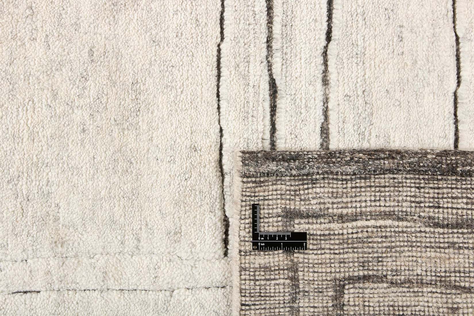 cream area wool rug with abstract design