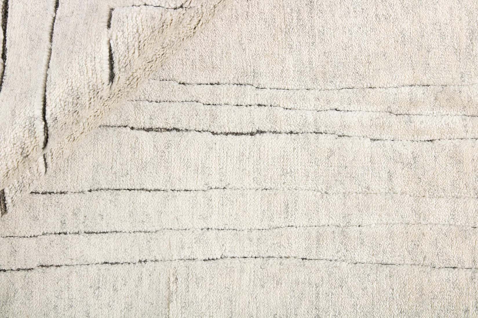 cream area wool rug with abstract design