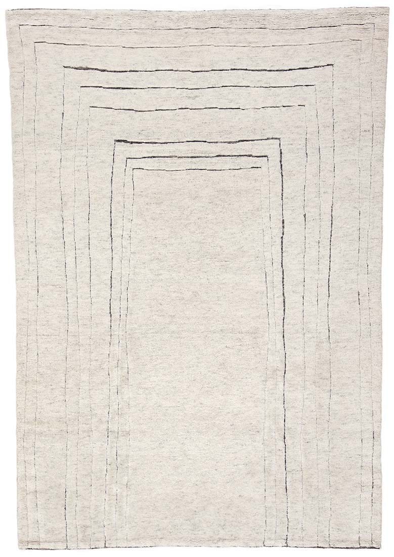 cream area wool rug with abstract design
