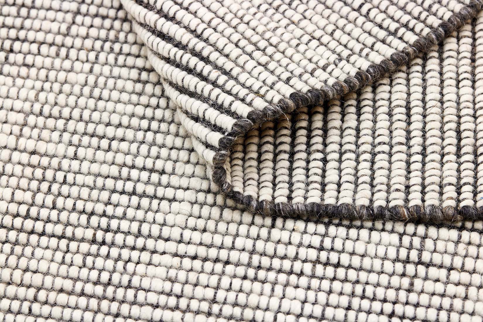 Dark grey and white textured flatweave rug