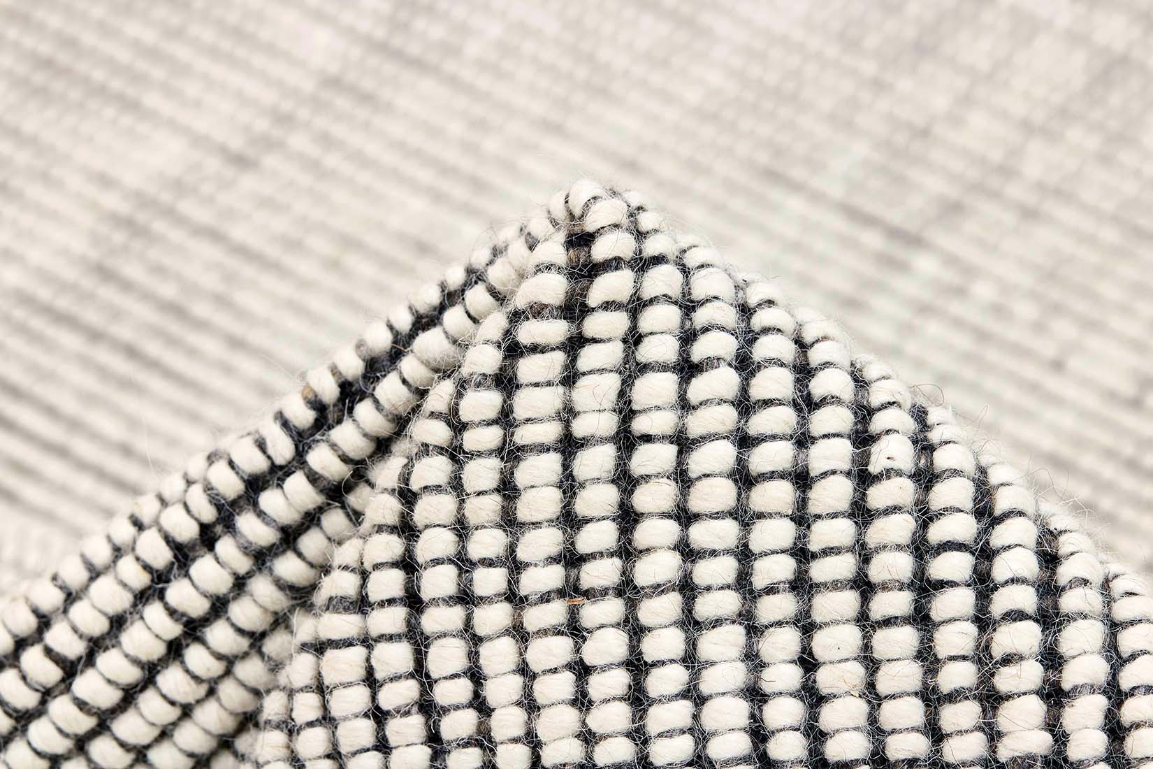 Dark grey and white textured flatweave rug