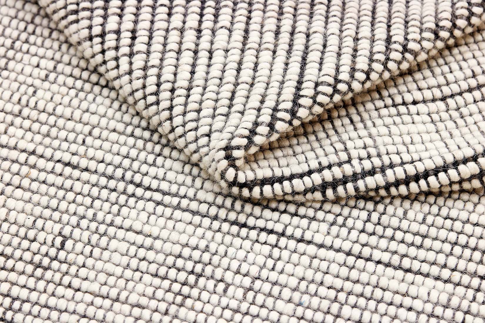 Dark grey and white textured flatweave rug