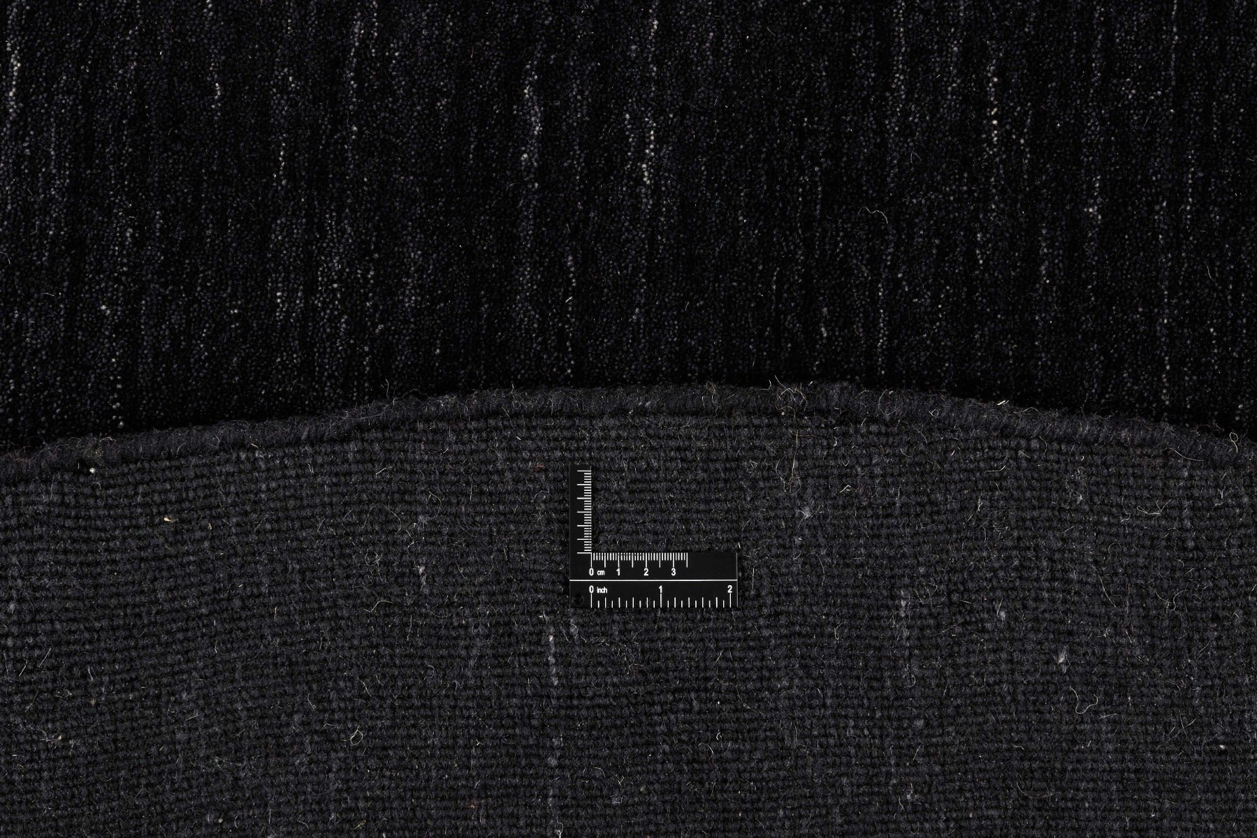 plain black wool circle rug