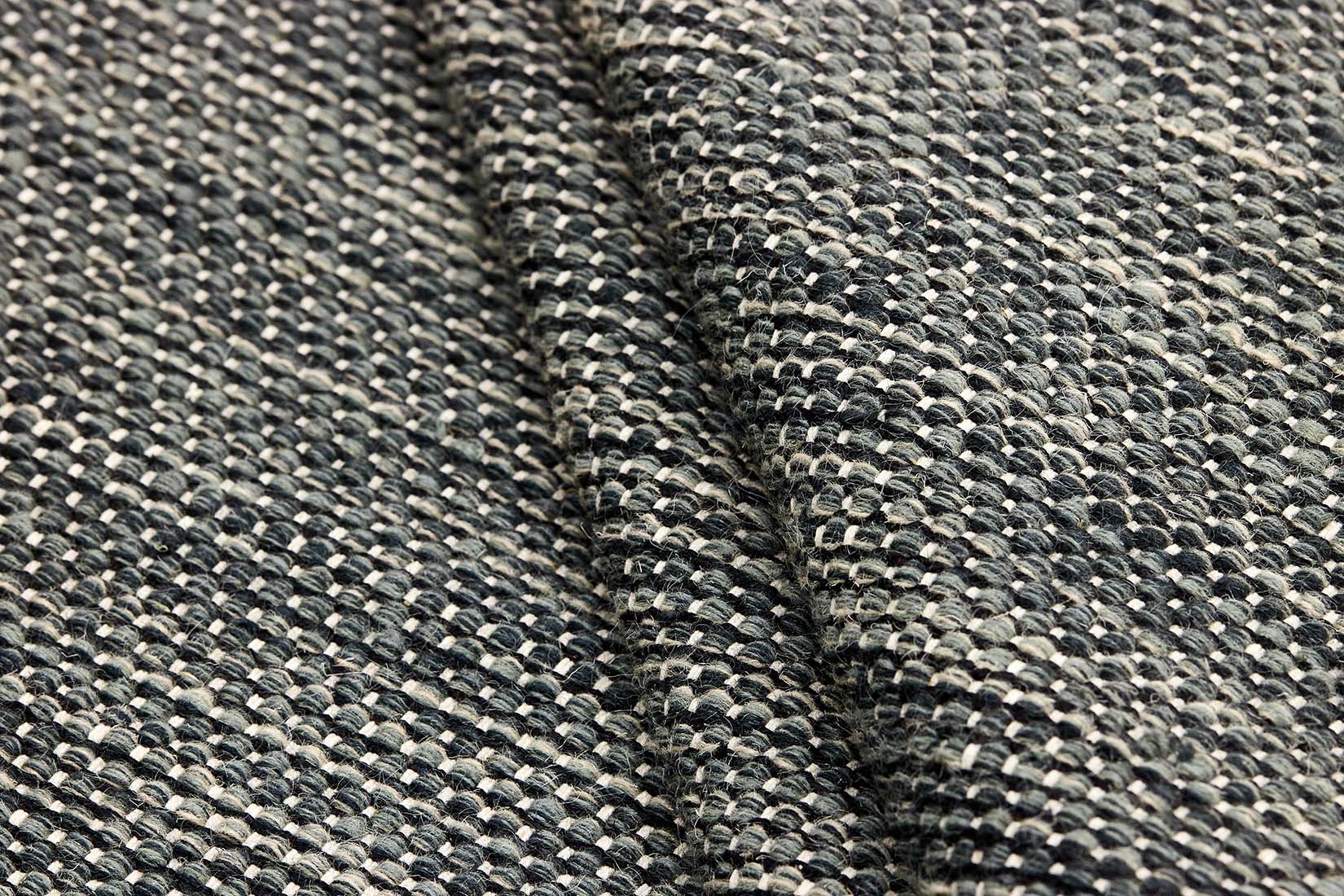 plain black and green flatweave wool rug