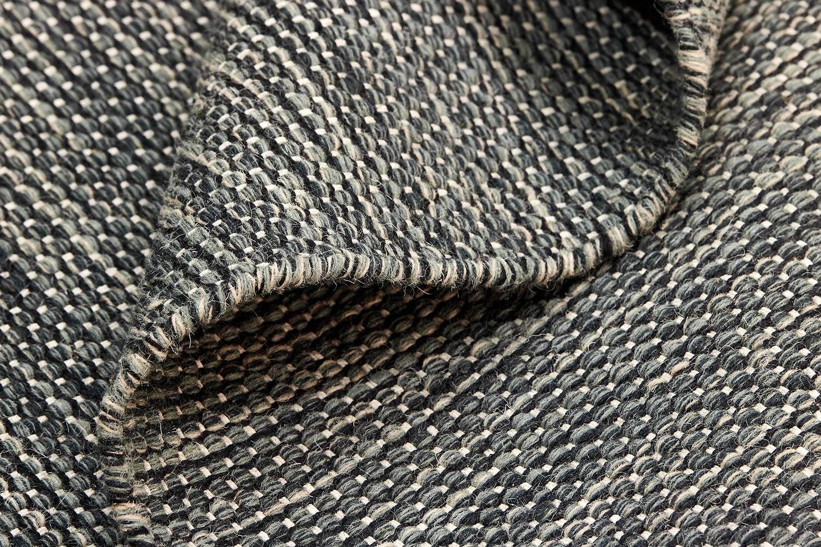 plain black and green flatweave wool rug